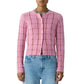 Person wearing the Jane Checker Cardigan by Guest in Residence with light blue jeans for a cozy yet stylish look.