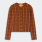 The Jane Checker Cardigan by Guest in Residence is a lightweight cashmere women’s long-sleeve cardigan in brown, featuring a pink windowpane check pattern, front buttons, and ribbed cuffs and hem, displayed on a flat white background.
