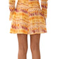 The back view shows someone wearing a Jason Wu Printed Silk Crinkle Chiffon Dress, featuring ombre floral tie-dye with a smocked waist, stylishly paired with black boots.