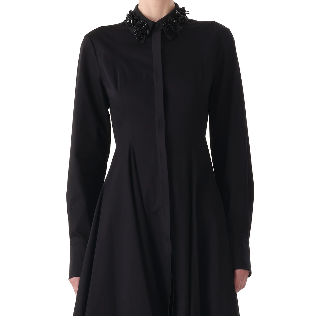 Person wearing a long-sleeved, black cotton Jason Wu Collection Asymmetric Dress with Embroidery Collar, shown from the neck to mid-thigh against a plain white background.