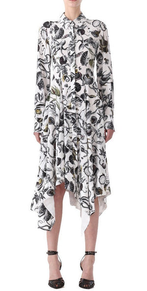 A person wearing a Jason Wu Collection Asymmetric Silk Dress with a marine print and asymmetrical hem, paired with black heels.