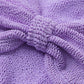 Close-up of the Hunza G Jean Bikini’s textured lavender fabric featuring a central gathered knot, with distinctive ruched and crinkled details—ideal for strap-free swimwear in a one size fits all design.