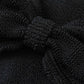 Close-up of black textured crinkle fabric with a knotted section in the center, displaying detailed wavy and raised patterns—ideal for the Hunza G Jean Bikini, featuring a one size fits all design.
