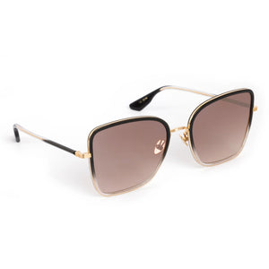 The Jolene Sunglasses by Krewe feature square gold metal frames, black temple tips, and oversized brown-tinted lenses.