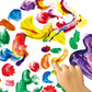 A child's hand explores vibrant, multicolored paint blobs and streaks on a Bright Stripes Jr. Jumbo Finger Paint Paper Pad by Bright Stripes.