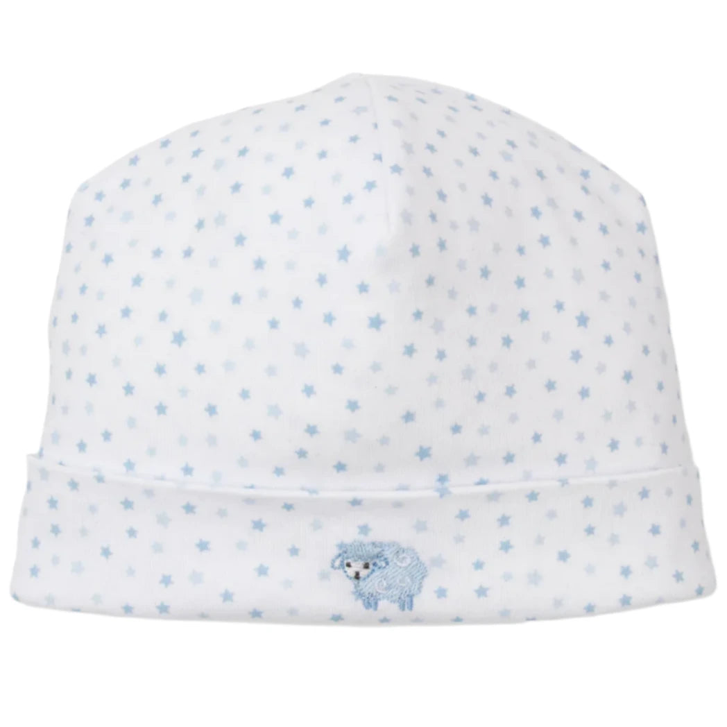 The Kissy Kissy Baby Baa Baa Baby Sheep Star Hat is a charming white baby hat with a blue star pattern and an embroidered sheep print on the front, made from soft Pima cotton for ultimate comfort.