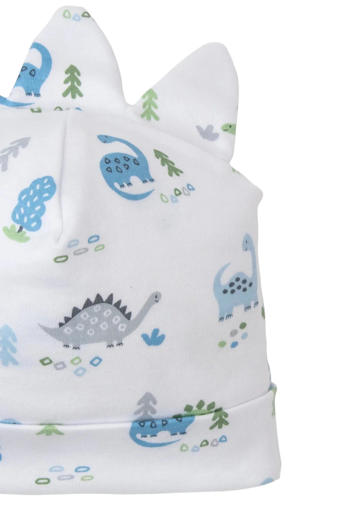 The Kissy Kissy Dinosaur Era Novelty Hat is a white Pima cotton baby hat with blue and gray dinosaur prints, green trees, and two playful ear-like details on top.