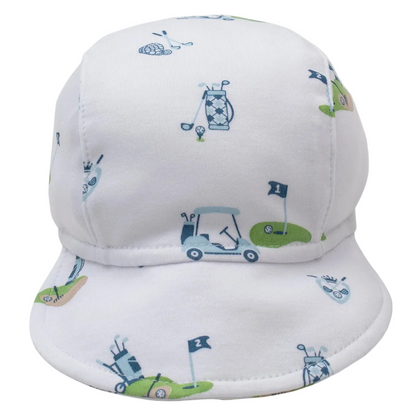 The Kissy Kissy Golf Championship Cap features blue and green golf-themed prints—carts, clubs, flags, and balls—and is crafted from soft Pima cotton for your baby.