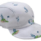 The Golf Championship Cap by Kissy Kissy is crafted from soft Pima cotton and features playful blue and green golf-themed prints of carts, flags, and clubs.