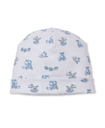 The Kissy Kissy Baby Vintage Toy Fun Hat is crafted in soft white Pima cotton and features a charming print of blue rocking horses, toy cars, planes, and cubes for a delightful vintage toy look.