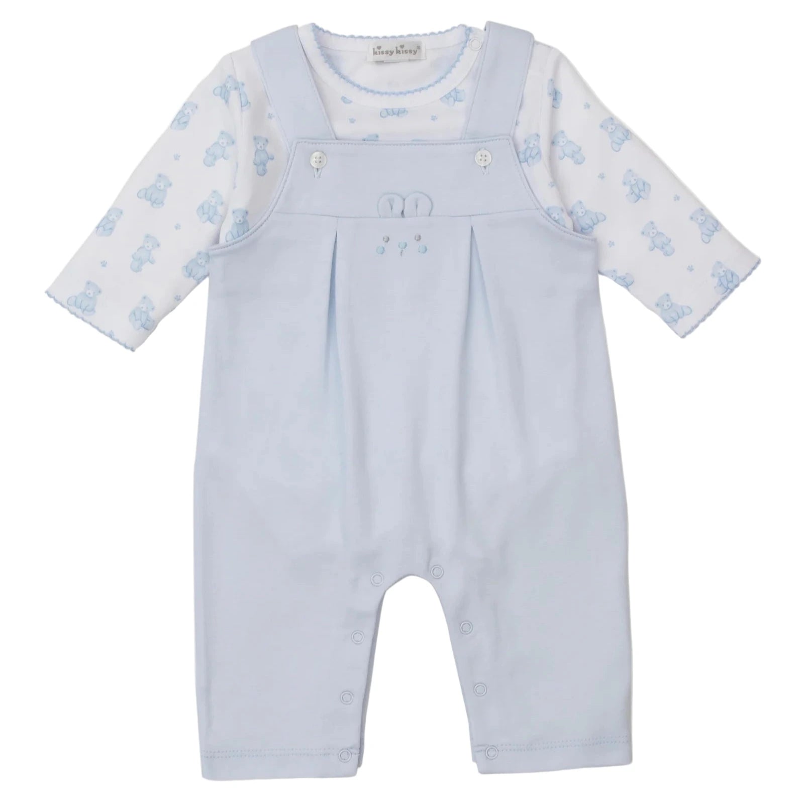 The Kissy Kissy Baby Teddy Bear Time Overall Set features light blue overalls with straps, front buttons, pleats, and a white long-sleeve pima cotton bodysuit decorated with a cute teddy bear print.