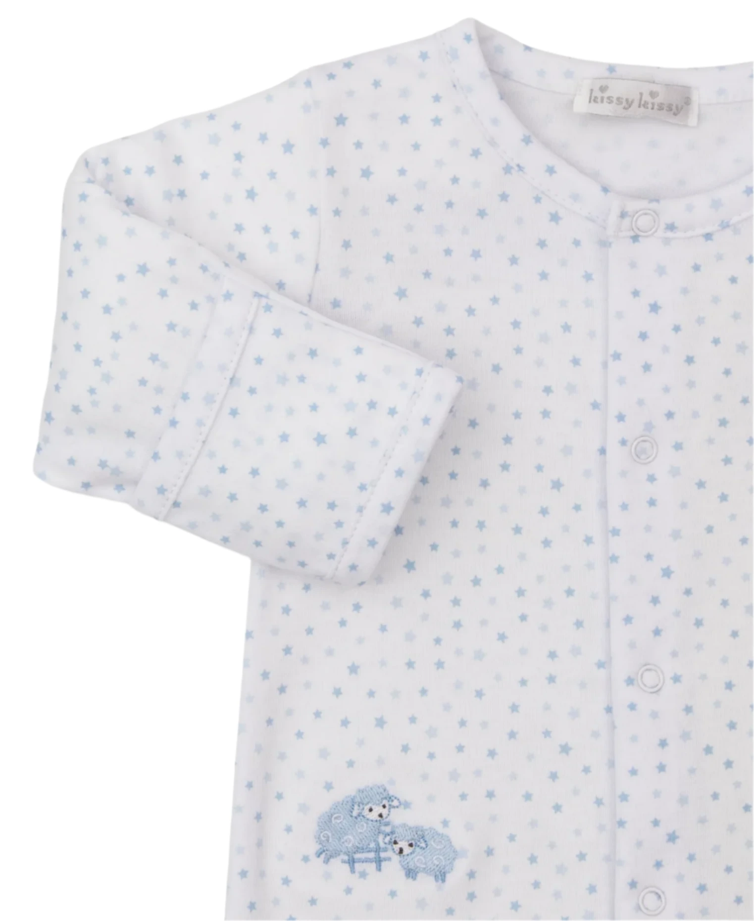 The Kissy Kissy Baa Baa Baby Sheep Star Footie is a white baby pajama made of soft Pima cotton with light blue stars. It has long sleeves, front buttons, and an embroidered baby sheep near the bottom for extra cuteness.