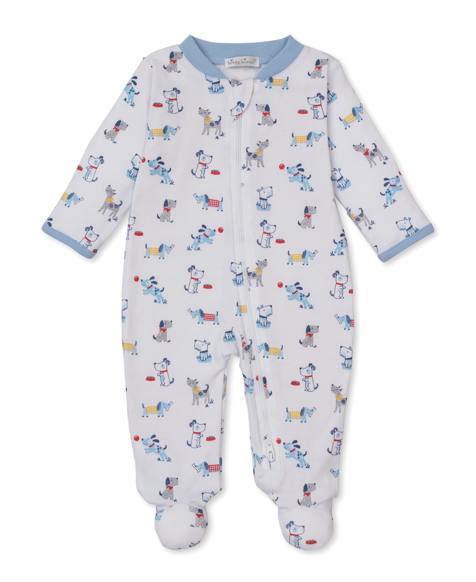 The Baby Boys’ Puppy Patch Zip Footie by Kissy Kissy is a white Pima cotton onesie featuring a colorful puppy patch print. Designed with a convenient front zipper and finished with light blue cuffs and collar, this soft zippered footie is displayed flat on a plain white background.