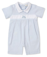 This adorable Kissy Kissy Cottontail Playsuit from the Premier Cottontail Hollows Collection boasts a white collar and sleeve cuffs. Crafted from soft Peruvian cotton, it features embroidered bunnies on the chest and a charming white horizontal band in light blue.