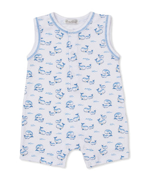Kissy Kissy Baby Boys’ Whale Pods Sleeveless Playsuit crafted from soft Pima cotton features a charming blue whale and wave pattern on white fabric, with front buttons and blue trim around the arm and neck openings—an adorable choice for summertime adventures.