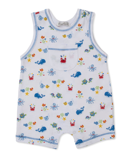 The Baby Boys’ Ocean Antics Sleeveless Playsuit by Kissy Kissy is crafted from soft white Pima cotton with contrasting blue trim and features a charming ocean antics print with whales, crabs, fish, and starfish. A small chest pocket is finished with playful red crab embroidery.