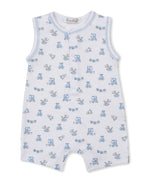 The Kissy Kissy Baby Boys’ Vintage Toy Fun Sleeveless Playsuit is crafted from soft Pima cotton and features a charming blue vintage toy print, front snap buttons, and white trim around the neck and arm openings.