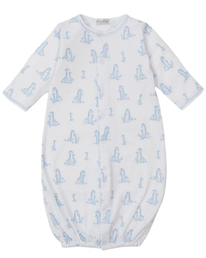 The Kissy Kissy Baby' Giraffe Grace Convertible Gown is crafted from soft Pima cotton, featuring an adorable giraffe print, long sleeves, and an elastic bottom hem for comfort.