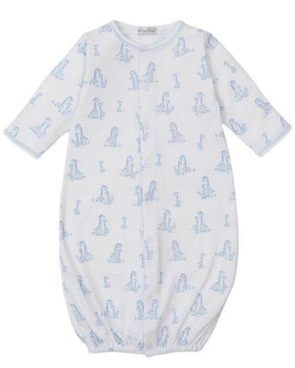 The Kissy Kissy Baby' Giraffe Grace Convertible Gown is crafted from soft Pima cotton, featuring an adorable giraffe print, long sleeves, and an elastic bottom hem for comfort.