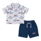 The Kissy Kissy Baby Boys’ and Boys’ Rescue Raid Bermuda Set features a short-sleeve polo shirt adorned with an allover rescue raid print of fire trucks and city scenes, paired with navy blue drawstring shorts finished with a small firetruck embellishment on the left leg.