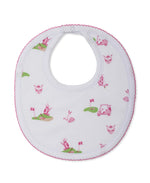 The Kissy Kissy Golf Championship Prt. Bib features soft Pima cotton, pink trim, and a playful golf print with pink and green carts, clubs, and flags—perfect for little golf fans.