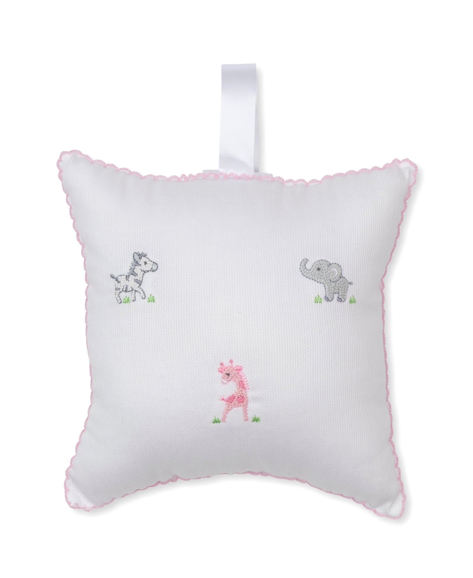 Kissy Kissy SCE Safari Party Musical Pillow—a white square pillow with pink trim, featuring embroidered gray zebra, gray elephant, and pink giraffe designs, plus a handy white hanging loop at the top—makes an adorable baby gift for any nursery.