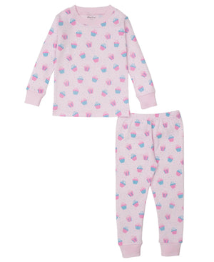 The Kissy Kissy Baby Girls' and Girls' Cupcake Party Pajama Set features soft Pima cotton with a pink long-sleeve top and matching pants adorned with blue and pink cupcakes—ideal for cozy nights.