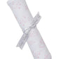 The Kissy Kissy Cheerful Good Night Printed Blanket features pink clouds, moons, and stars on white Pima cotton. This cozy baby blanket is rolled up and tied with a gray "Kissy Kissy" ribbon for your little one's comfort.