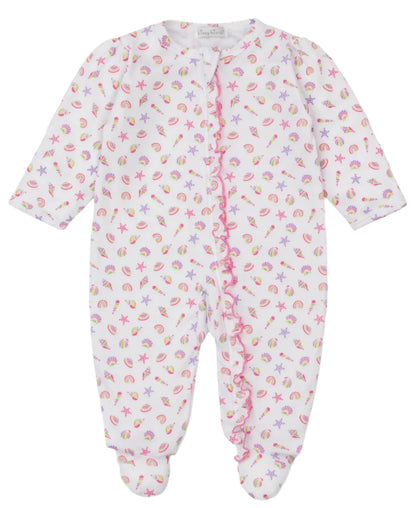 The Kissy Kissy Baby Girls' Sea Shell Magic Zip Footie is a white, long-sleeve Pima cotton onesie with playful pink and purple sea shell print, starfish details, and pink ruffle trim.