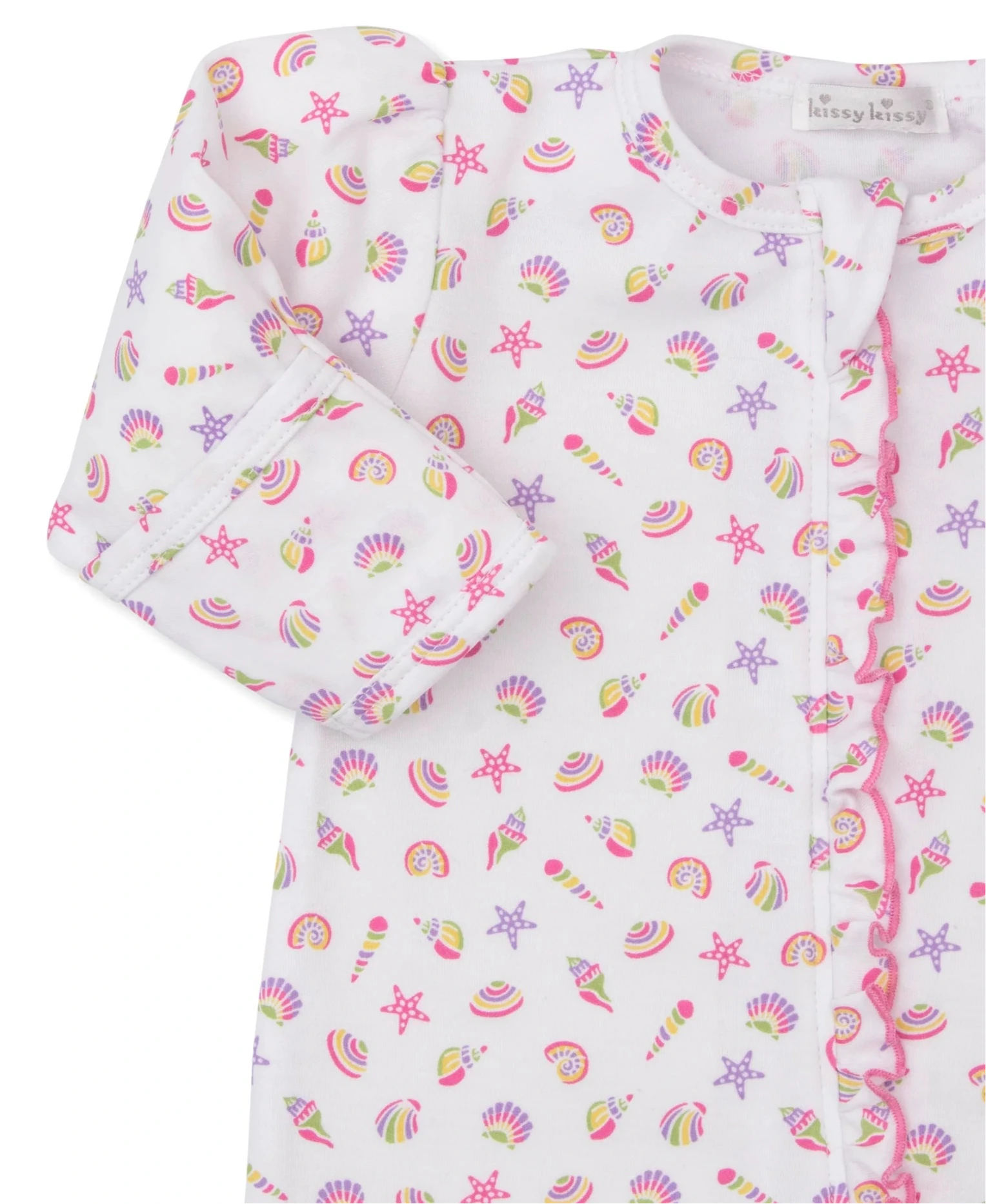 Close-up of Kissy Kissy’s Baby Girls' Sea Shell Magic Zip Footie, made from soft Pima cotton, featuring a sea shell print on white and ruffled pink trim along the zipper.
