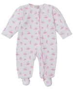 The Kissy Kissy Baby Girls' Ready to Dance Zip Footie is a white long-sleeve Pima cotton footie with footed legs, featuring a pink smiling face and sun pattern, shown laid flat on a white background.