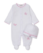 The Kissy Kissy Baby Whale Pods Footie with Hat Set features a cozy footie and matching hat, both made from ultra-soft Pima cotton. Each piece is accented with delicate pink stitching and adorable pink whale embroidery, all presented on a crisp white background.