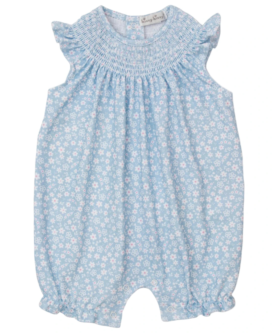 The Kissy Kissy Baby Girls' Fall in Bloom Smocked Sleeveless Playsuit features a white floral pattern, ruffled shoulders, smocked neckline, and elastic leg openings.