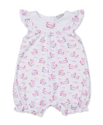 The Kissy Kissy Baby Girls' Whale Pods Playsuit, crafted from white Pima cotton and featuring flutter sleeves, a pink and blue whale pods print, and elastic leg openings, is displayed on a plain background.