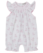 The Kissy Kissy Baby Girls' Springtime Bunny Fun Pink Short Smocked Playsuit features soft Pima cotton, a pink bunny print, ruffled sleeves, a smocked neckline, and delicate pink stitching.