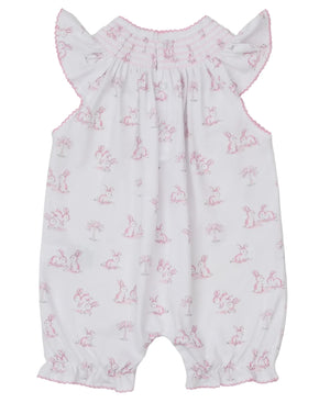 The Kissy Kissy Baby Girls' Springtime Bunny Fun Pink Short Smocked Playsuit features soft Pima cotton, a pink bunny and tree print, flutter sleeves, shirred neckline, and gathered leg cuffs.