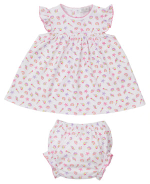 The Kissy Kissy Baby Girls' Sea Shell Magic Dress Set features a white Pima cotton dress and bloomers with a colorful sea shell print, flutter sleeves, and pink trim.