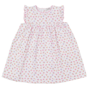 The Girls' Sea Shell Magic Dress by Kissy Kissy is a white sleeveless Pima cotton toddler dress with ruffled shoulders and a pink sea shell print featuring starfish accents.