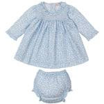 The Kissy Kissy Baby Girls' Fall in Bloom Printed Smocked Dress Set features a light blue long-sleeve Pima cotton dress with a white floral print, ruffled collar and cuffs, plus a coordinating diaper cover.