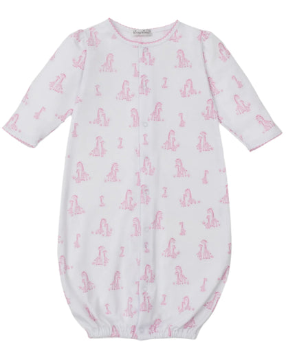 The Kissy Kissy Baby' Giraffe Grace Convertible Gown is a white, long-sleeve infant gown made from soft Pima cotton with a pink giraffe print and an elasticized hem.