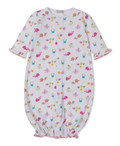 The Kissy Kissy Baby Ocean Antics Convertible Gown is crafted from soft Pima cotton and features pink sea creatures alongside a colorful floral pattern. This versatile playsuit offers long sleeves and gentle elastic at the cuffs and hem, ensuring ultimate comfort for your little one.