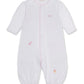 The Kissy Kissy Baby SCE Jungle Hang Out Convertible Gown is a white long-sleeve gown made from soft Peruvian cotton, detailed with pink trim and small embroidered animal designs including an elephant, giraffe, and lion.