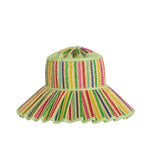 The Luxe Capri Hat by Lorna Murray is a wide-brimmed UPF 50+ sun hat featuring a light green crown, multicolored vertical stripes, a ruffled brim edge, and a decorative gathered top—making it an ideal choice for travel and sunny days.