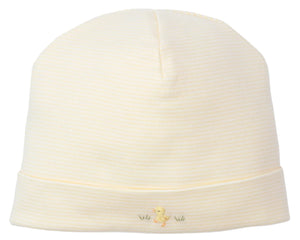 The Kissy Kissy Premier Baby Duckling Yellow Stripe Hand Emb. Hat is a pale yellow baby hat in soft Peruvian cotton, featuring subtle stripes and a hand-embroidered duckling on the front fold.