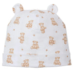 The Kissy Kissy Teddy Bear Time Novelty Printed Hat is crafted from white Pima cotton, features a light brown teddy bear and paw print pattern, and is topped with two small fabric ears.