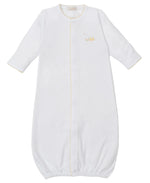 The Kissy Kissy Premier Baby Duckling Hand Emb. Conv. Gown is made from premium Pima cotton with white long sleeves, yellow trim, an elastic bottom, and a hand-embroidered duckling on the left chest.