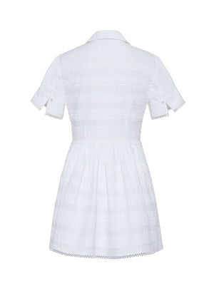 Back view of the Cara Cara Kai Mini Dress with a collared neckline, buttoned sleeves, delicate lace insets, and a slightly gathered waist for an effortlessly chic look.