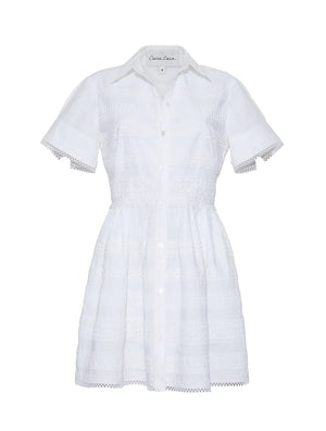 The Kai Mini Dress by Cara Cara is a white short-sleeve, button-down dress with a collared neckline and delicate lace insets on the bodice, skirt, and sleeves for an effortlessly charming style.