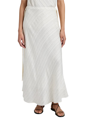 A person wearing the Proenza Schouler White Label Kaia Woven Stripe Skirt, with an ankle-grazing hem and subtle diagonal stripes, paired with black sandals, shown from waist to feet.