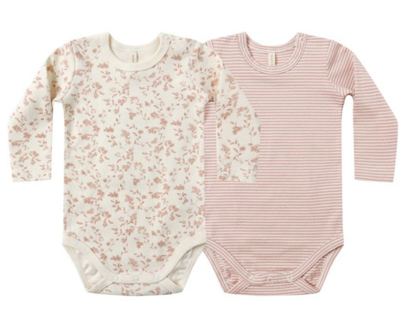 The Quincy Mae Baby Jersey Bodysuit 2-Pack includes two long-sleeve bodysuits in pink floral and pink/white stripes, made from soft organic brushed jersey with snap closures for easy changing.